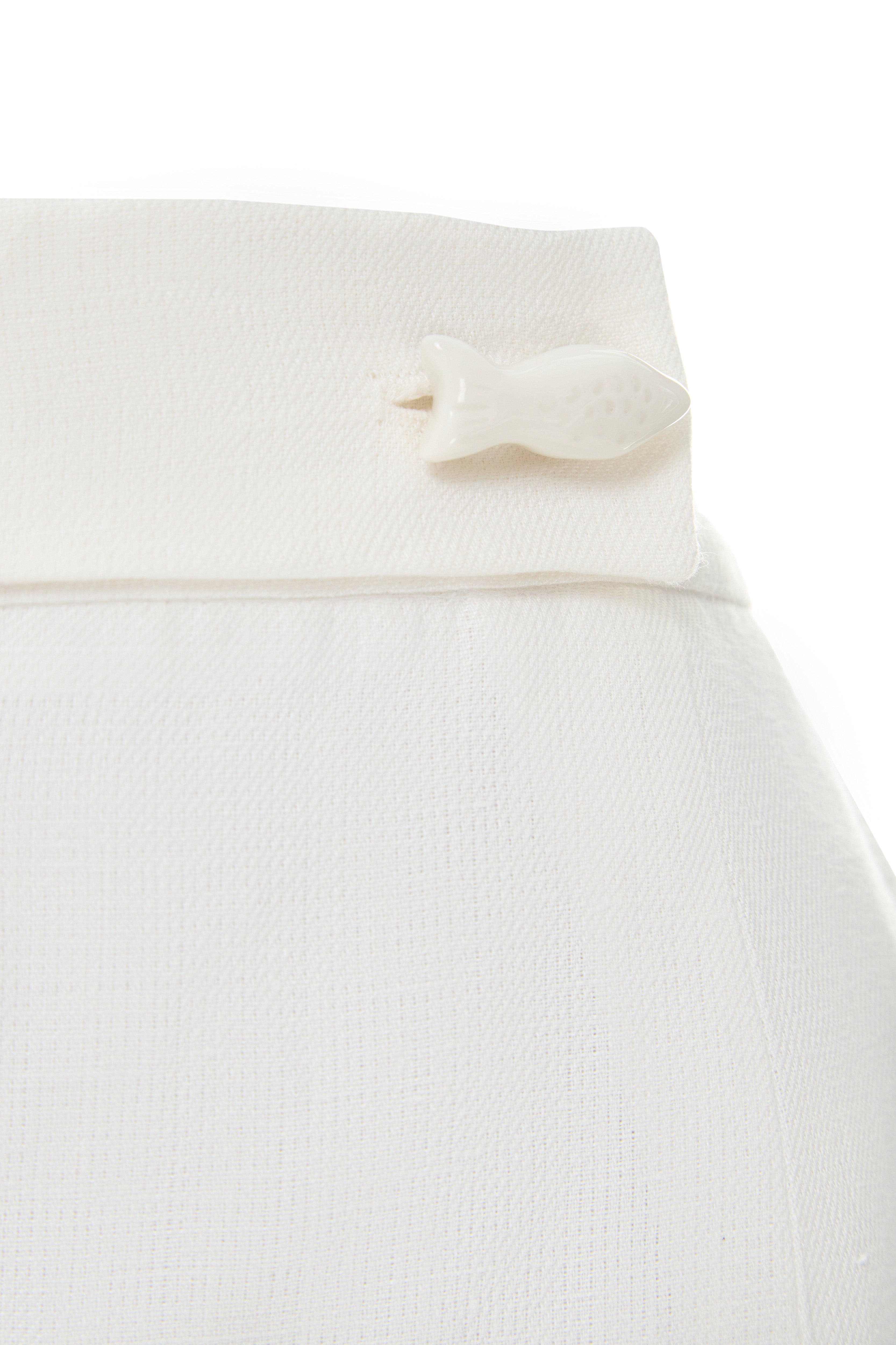 Close-up of the ceramic button detail on the Jamemme Halkidiki White organic linen shorts