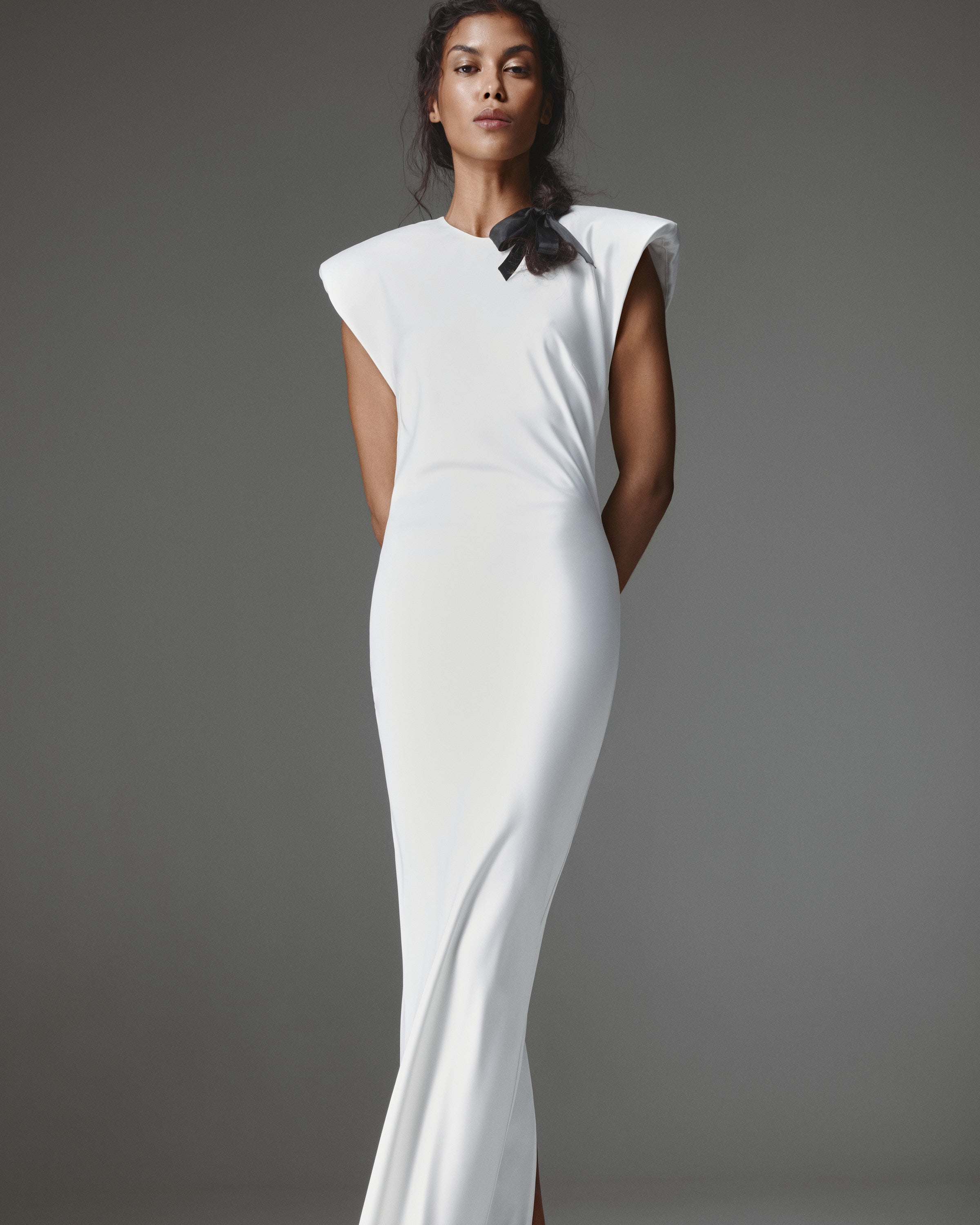 Clemence Dress by J'amemme — close front view of strong cap-sleeve shoulders and black ribbon bow at the round neckline