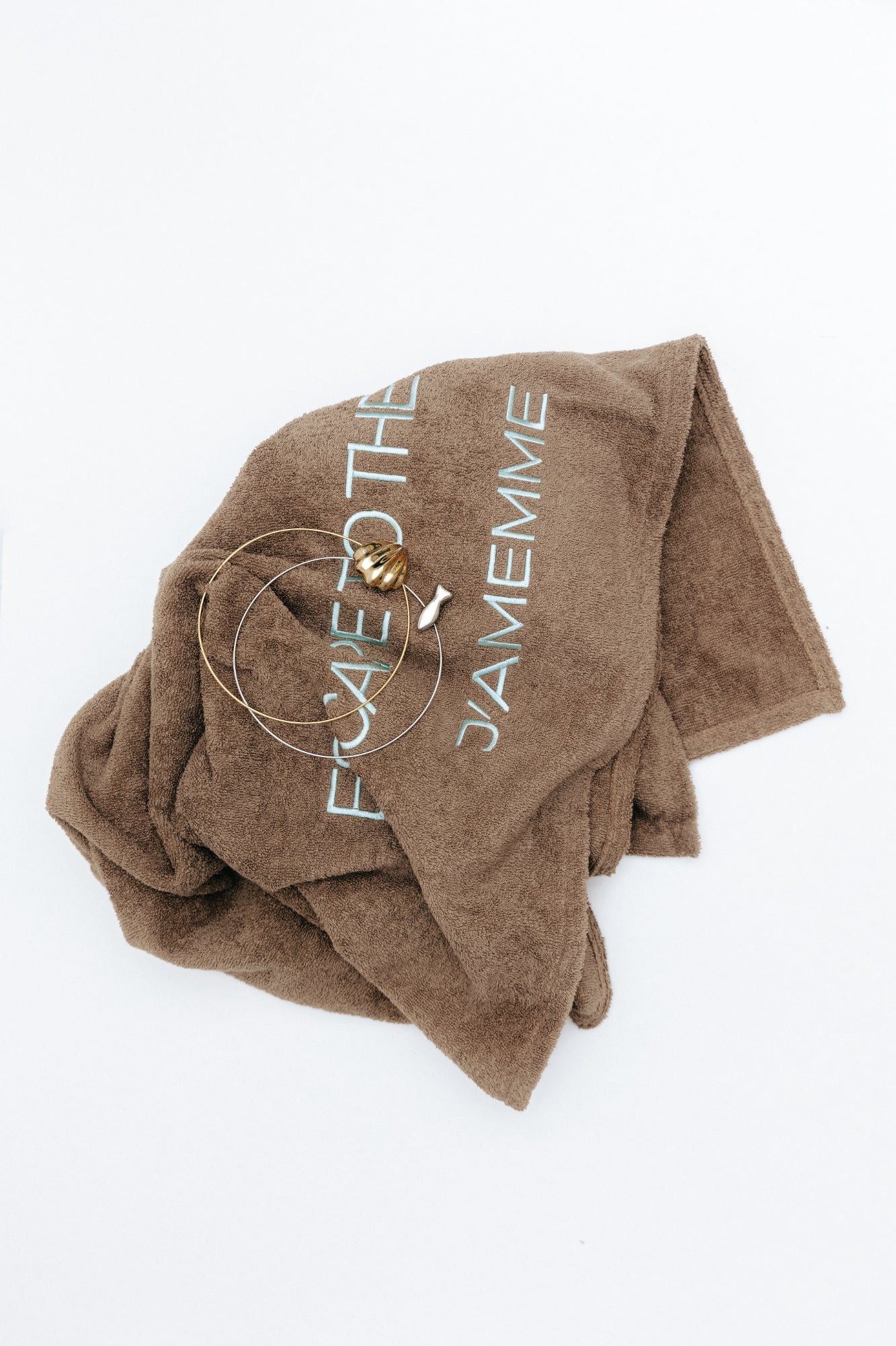 Chocolate brown cotton beach towel shown folded, 90x140cm — J'AMEMME