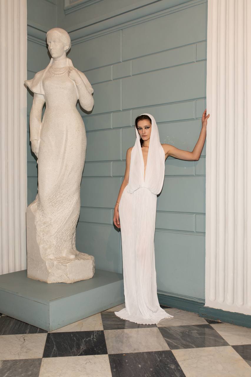 Liona Chiffon Dress by J'amemme - model in hooded pleated chiffon bridal gown