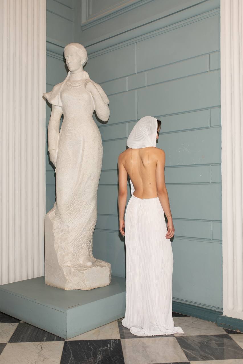 Liona Chiffon Dress by J'amemme - model open back detail, hooded chiffon gown