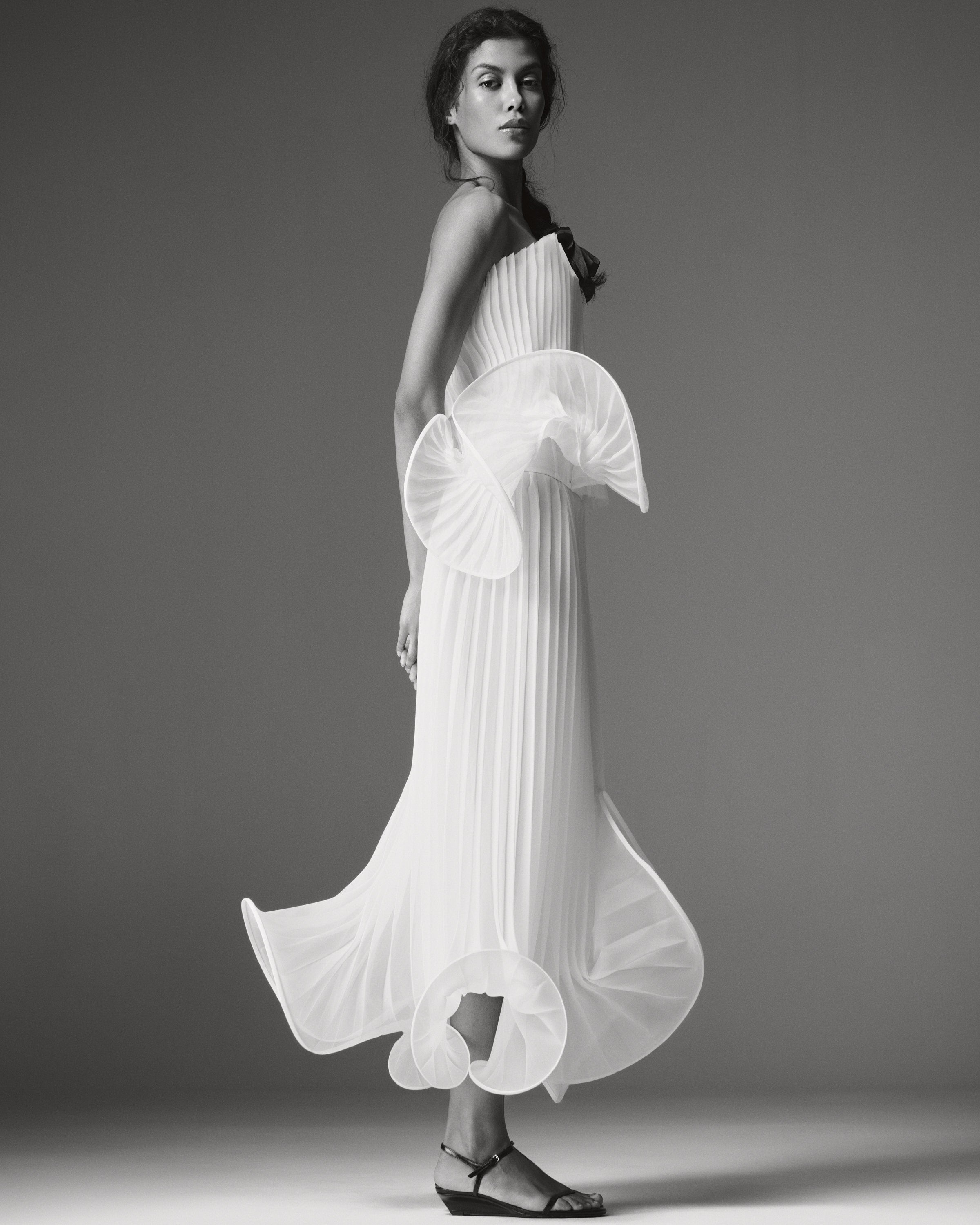 Nina Pleated Set by J'amemme — side view of the pleated chiffon set with sculptural organza ruffle at the hip