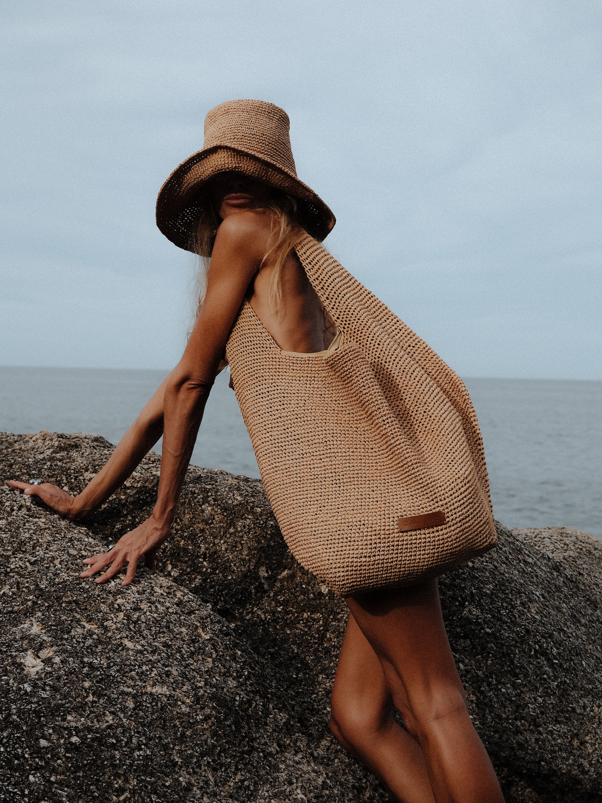 Beige raffia beach bag shown open — J'AMEMME Summer