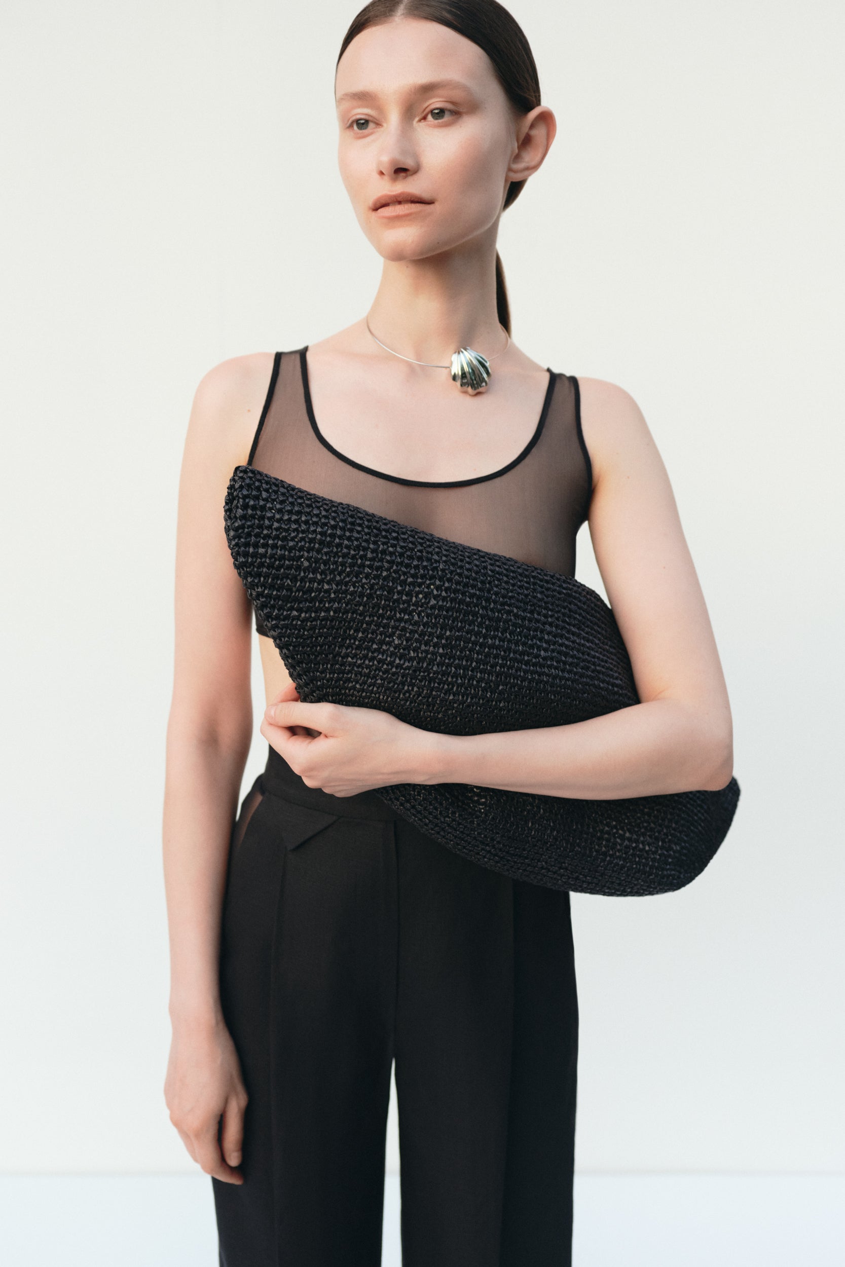 Black raffia beach bag shown from above — J'AMEMME Summer