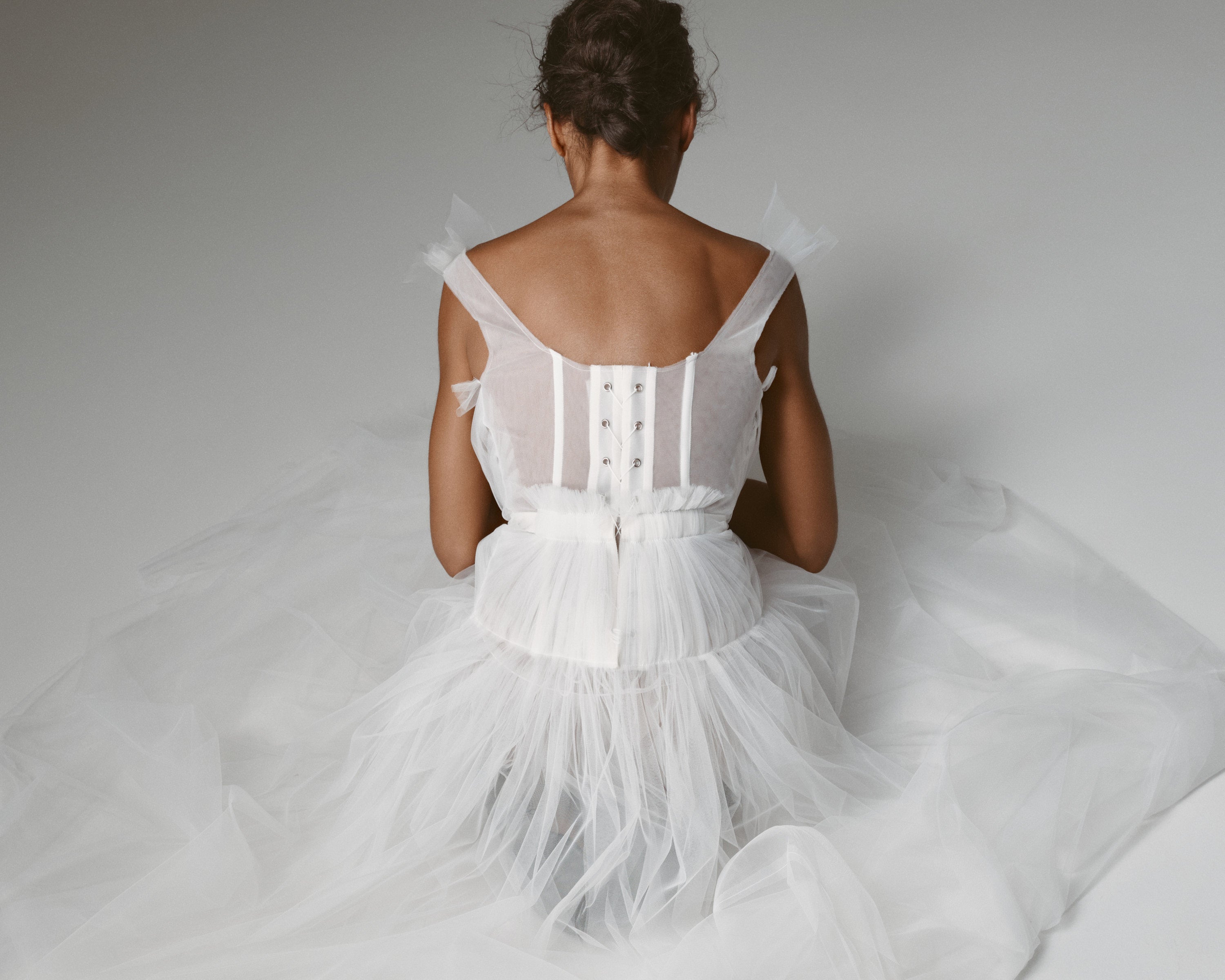 Bellini Corset Dress by J'amemme — back view showing the lace-up corset with eyelets and ribbon ties
