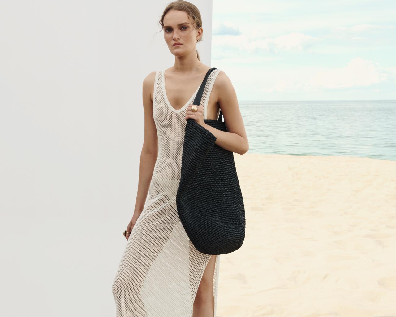 Black Delos raffia tote bag shown open from above — J'AMEMME Resort '27