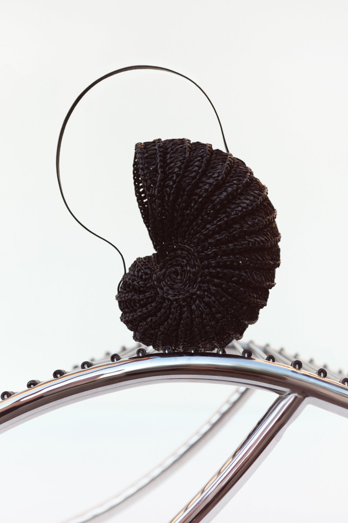 Black Nautilus raffia shell bag shown open — J'AMEMME