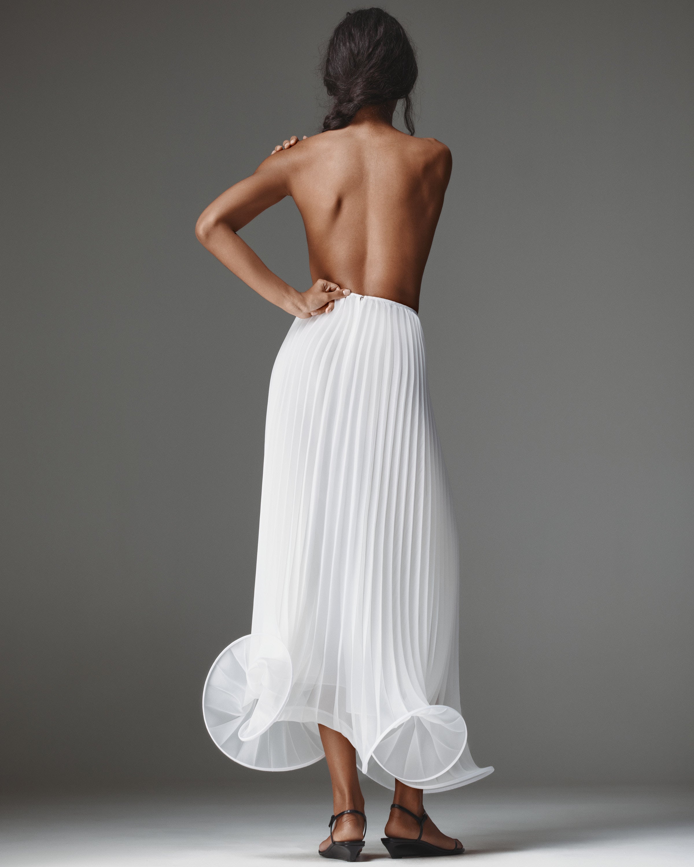 Nina Pleated Set by J'amemme — back view of the strapless pleated set with open back and organza ruffle hem