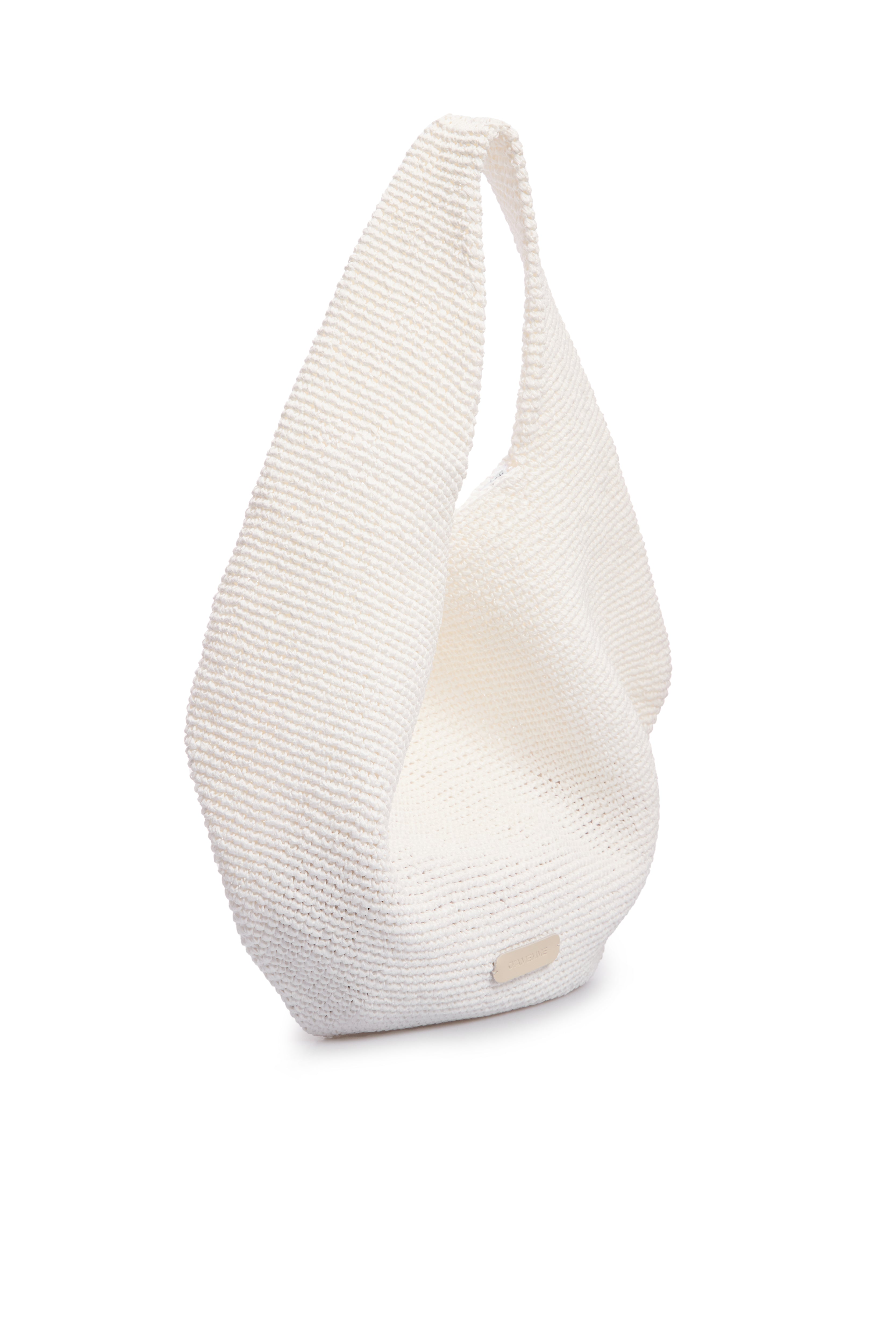 White raffia beach bag shown from the side — J'AMEMME Summer