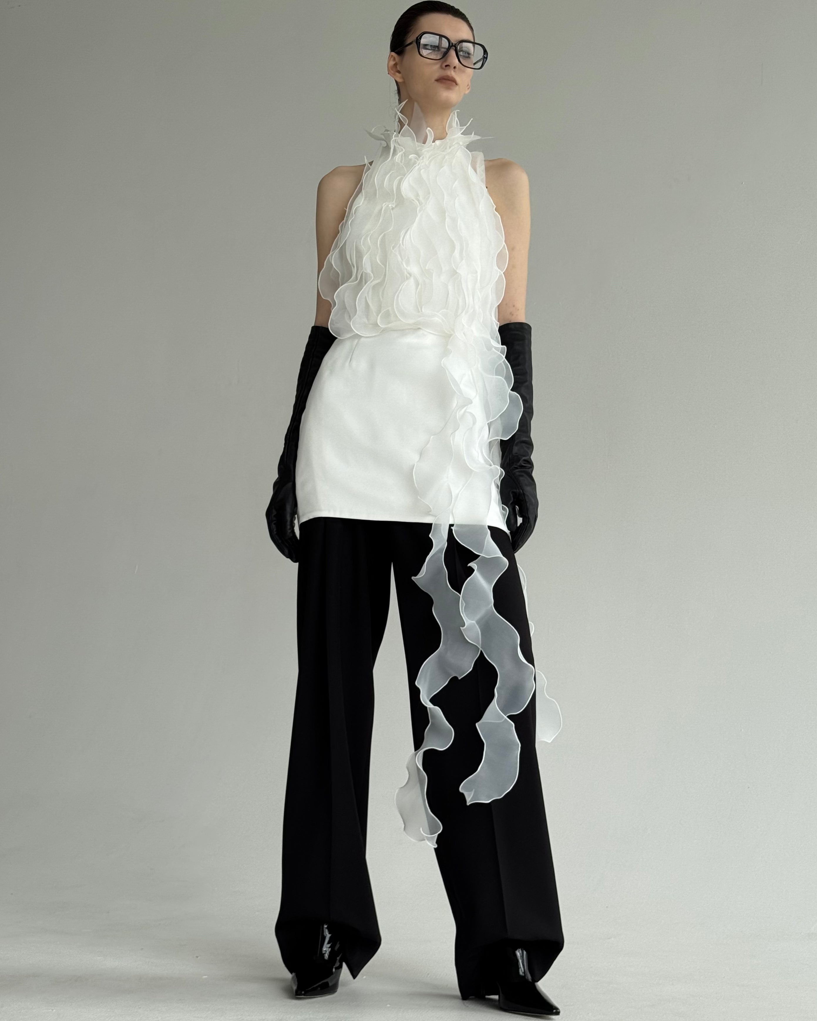 Model wearing Jellyfish Dress in White by J'amemme — front view, avant-garde bridal top with flowing organza ruffles